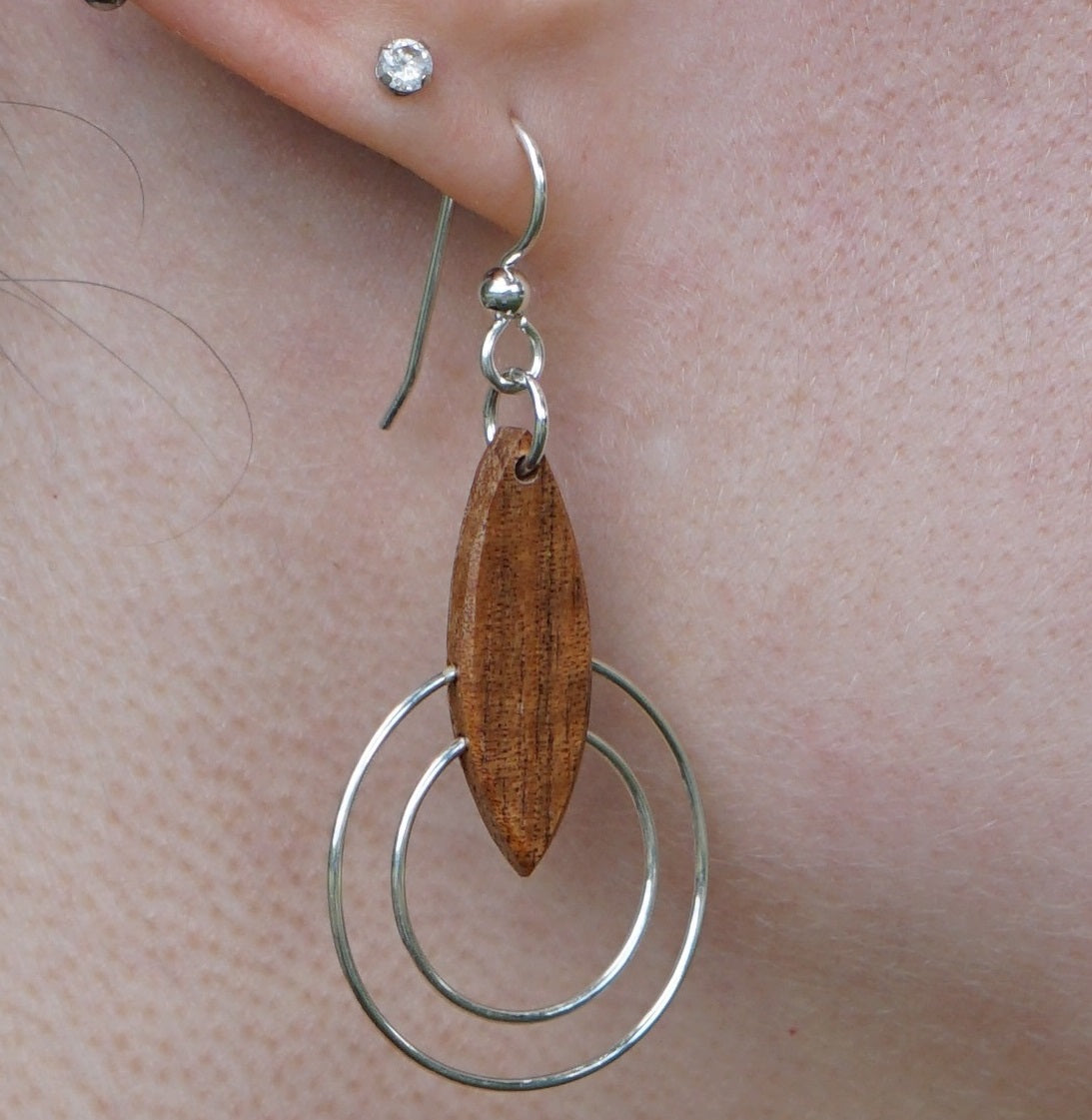 Koa  and silver double ring earrings on model