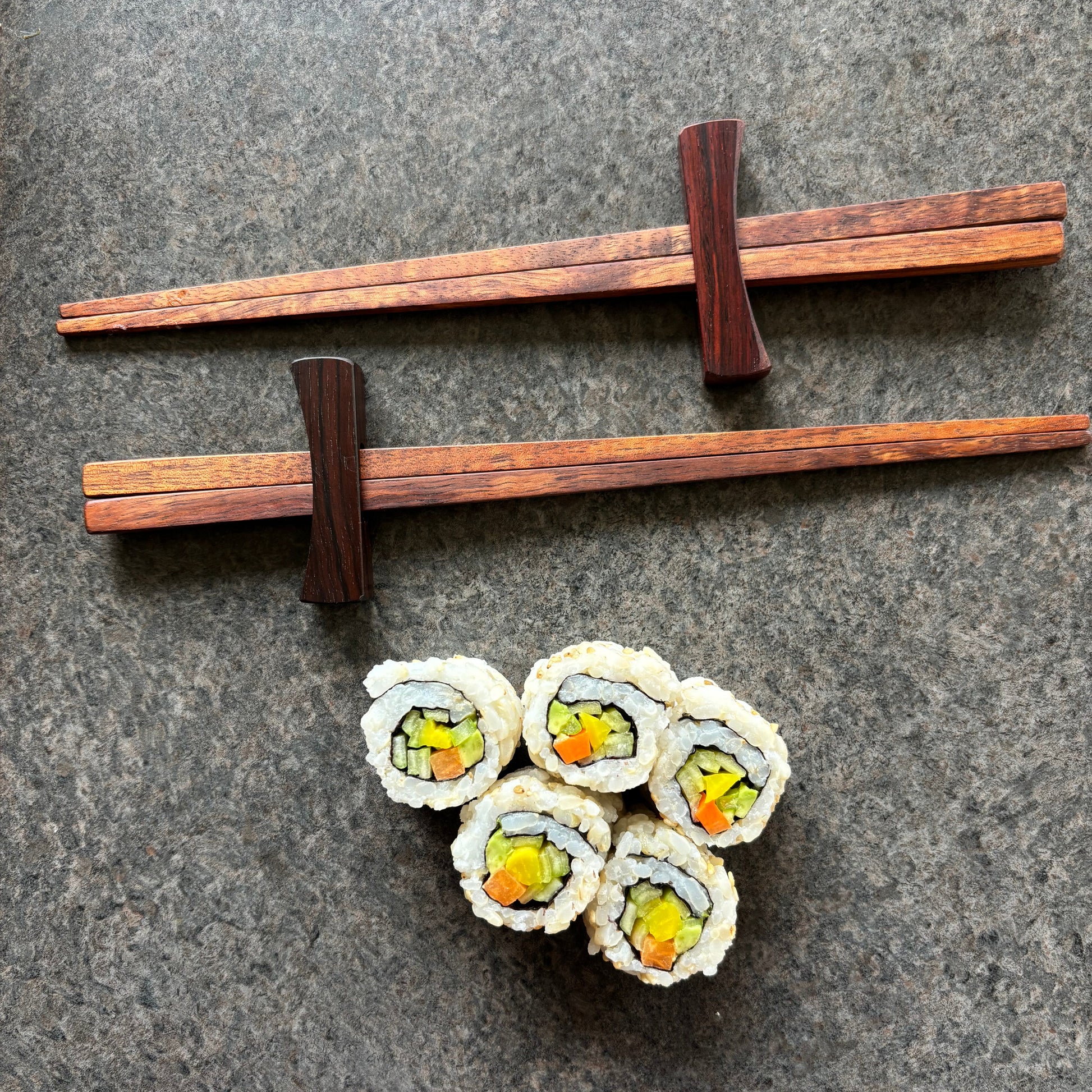 Chopstiks with sushi